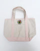 small canvas tote bag with pink straps and embroidered personify flower
