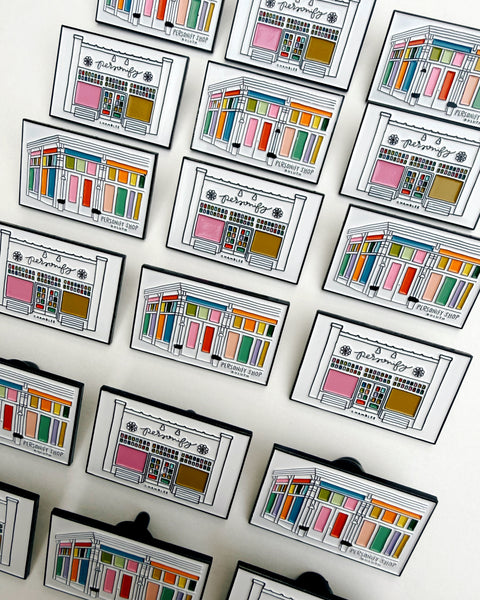 enamel pins featuring colorful illustrations of personify shops in duluth and chamblee, georgia