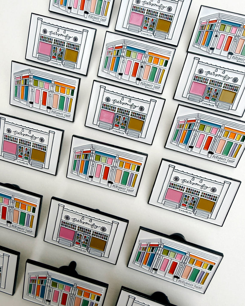 enamel pins featuring colorful illustrations of personify shops in duluth and chamblee, georgia
