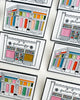 lapel pins featuring illustrations of chamblee and duluth's personify storefronts