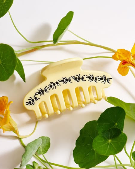 butter yellow hair claw with black rhinestone ants