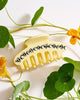 butter yellow hair claw with black rhinestone ants