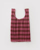 pleated reusable bag in a pink plaid pattern