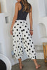 white lounge pants with black polka dots throughout