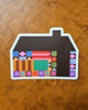 sticker in the shape of a house with a colorful quilt-inspired design