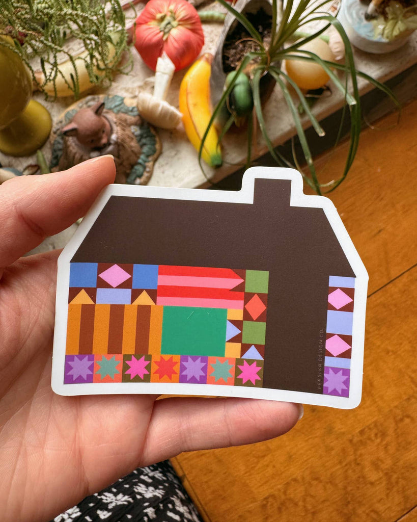 sticker in the shape of a house with a colorful quilt-inspired design