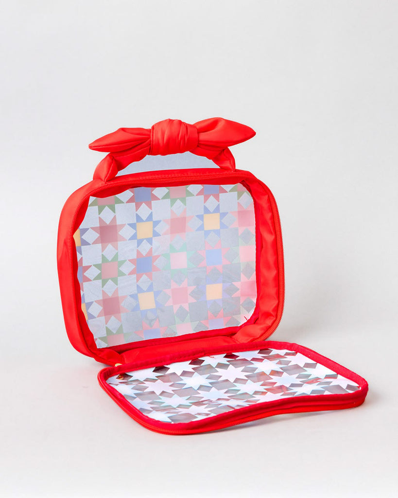 vinyl travel bag with a colorful quilt-inspired design