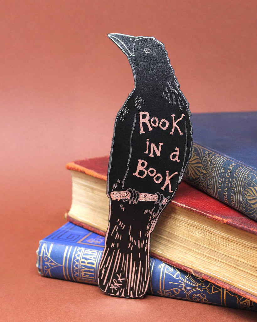 genuine leather bookmark in the shape of a rook with the message "rook in a book"
