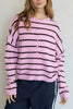 baby pink and black striped cardigan with a classic shape.