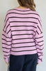 baby pink and black striped cardigan with a classic shape.