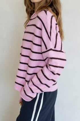 baby pink and black striped cardigan with a classic shape.