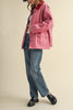 special utility jacket in rosy pink with a contrasting red collar.