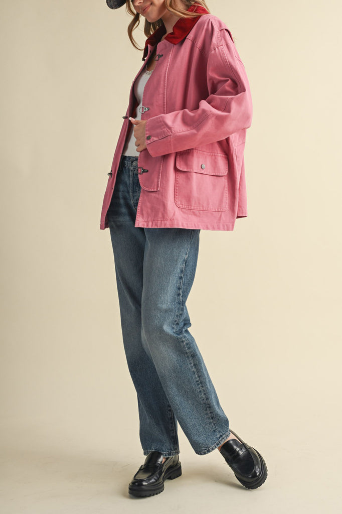special utility jacket in rosy pink with a contrasting red collar.