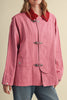 special utility jacket in rosy pink with a contrasting red collar.
