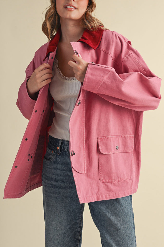 special utility jacket in rosy pink with a contrasting red collar.