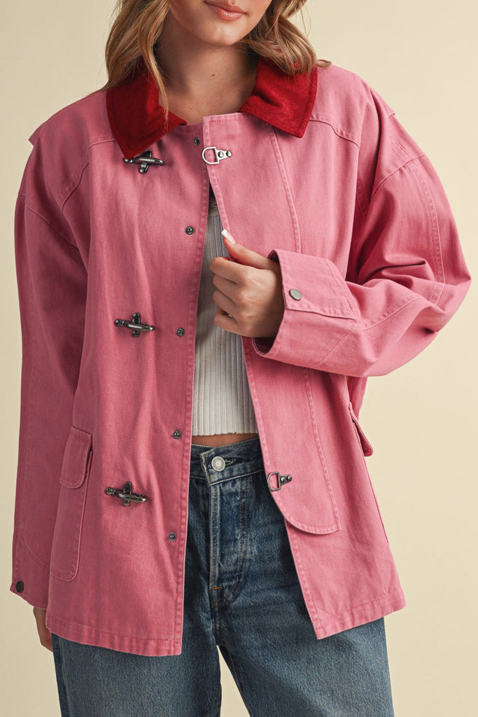 special utility jacket in rosy pink with a contrasting red collar.