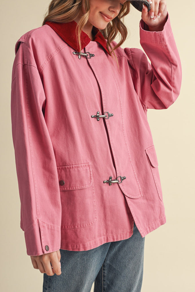 special utility jacket in rosy pink with a contrasting red collar.