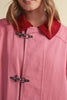 special utility jacket in rosy pink with a contrasting red collar.