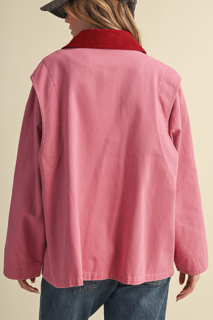 special utility jacket in rosy pink with a contrasting red collar.
