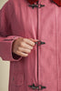 special utility jacket in rosy pink with a contrasting red collar.
