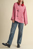 special utility jacket in rosy pink with a contrasting red collar.