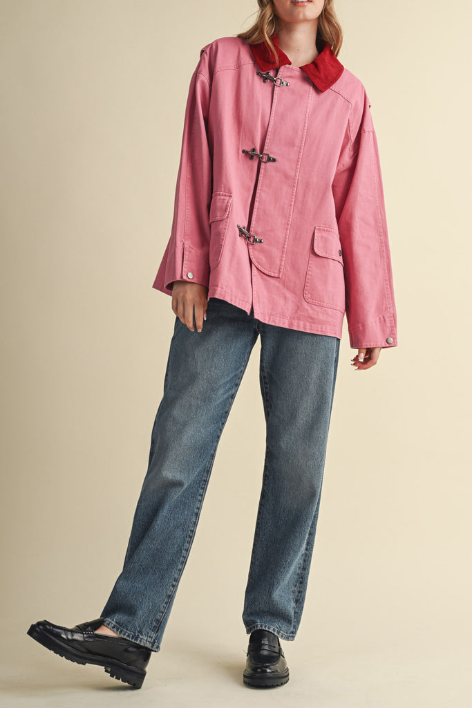 special utility jacket in rosy pink with a contrasting red collar.