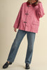 special utility jacket in rosy pink with a contrasting red collar.