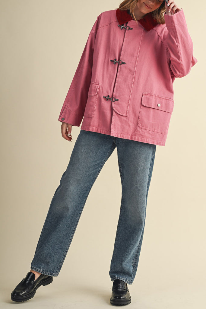special utility jacket in rosy pink with a contrasting red collar.