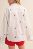 menswear-inspired button down top in crisp white with embroidered sailboats throughout