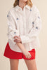 menswear-inspired button down top in crisp white with embroidered sailboats throughout