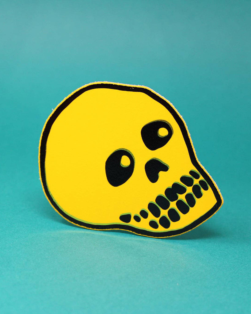 genuine leather skull coaster in yellow