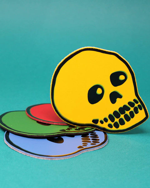 genuine leather skull coasters in a variety of bold colors