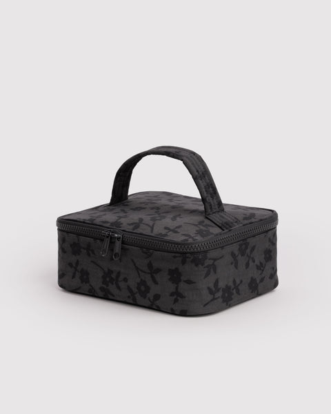 small cosmetic case in a charcoal ditsy floral pattern