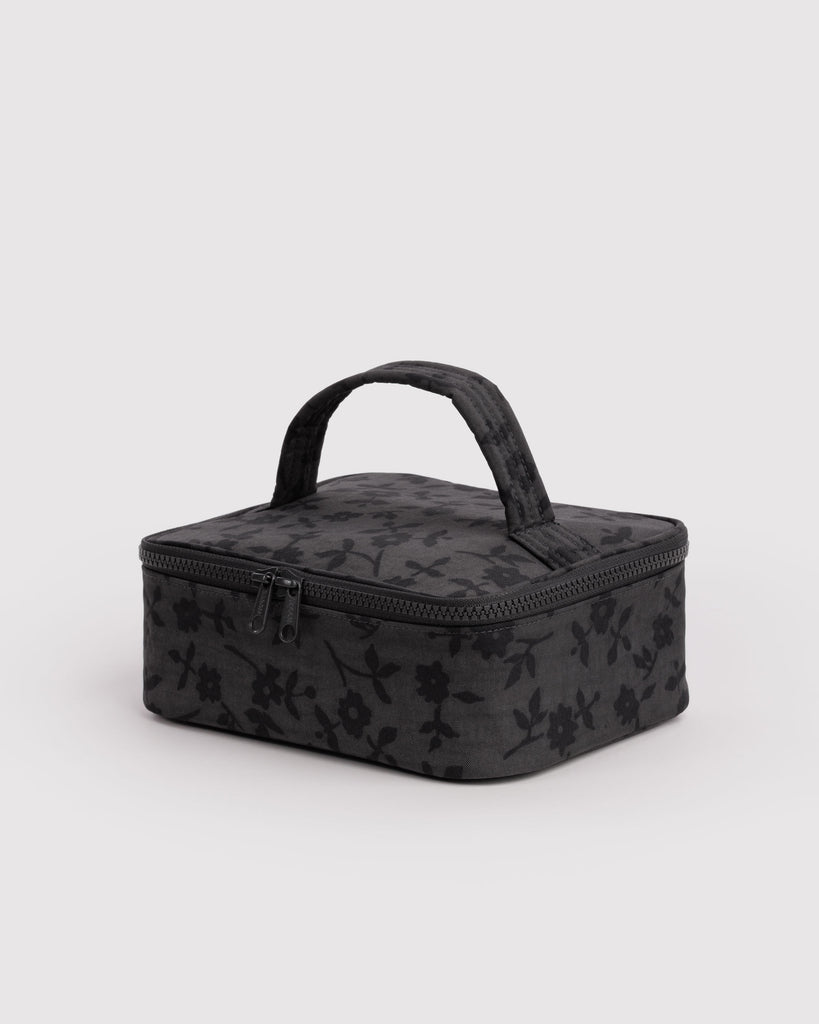 small cosmetic case in a charcoal ditsy floral pattern