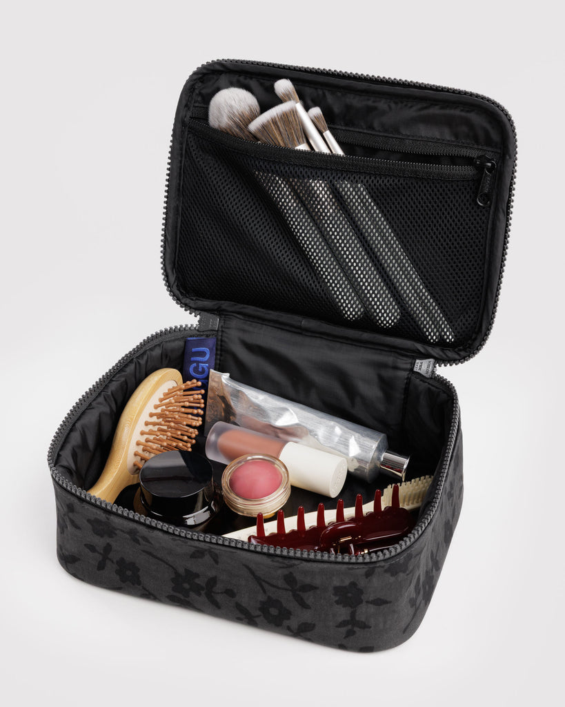 small cosmetic case in a charcoal ditsy floral pattern