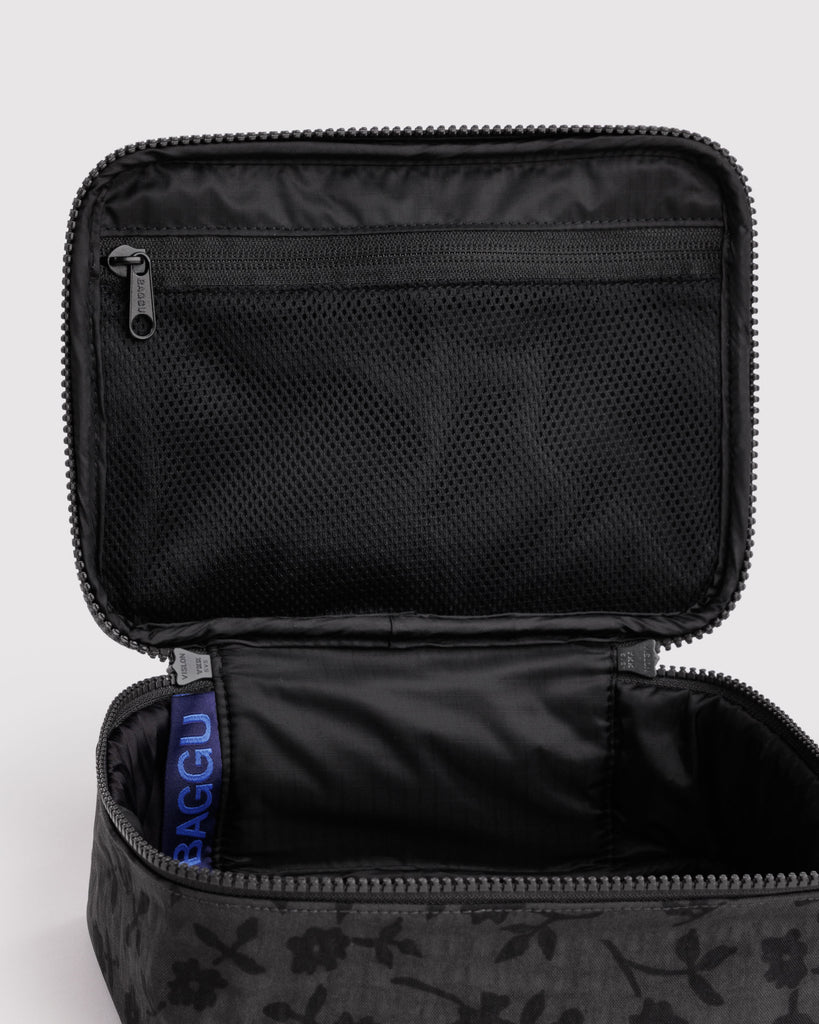 small cosmetic case in a charcoal ditsy floral pattern