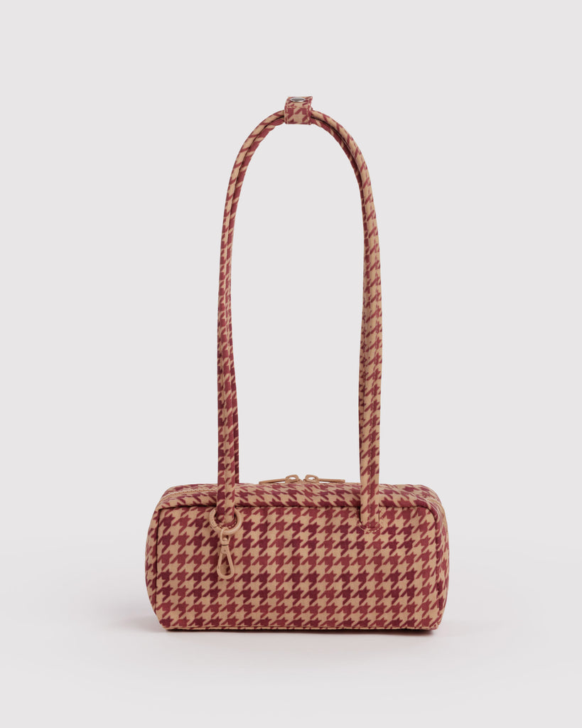 small nylon bowler bag in a tan houndstooth pattern