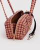 small nylon bowler bag in a tan houndstooth pattern