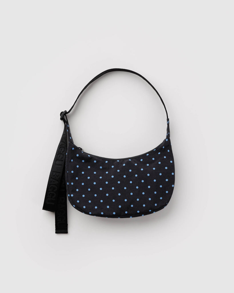 small nylon crescent bag from baggu in black with micro polka dots in sky blue