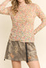 nude colored mesh top with a colorful polka dot pattern