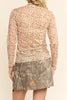 nude colored mesh top with a colorful polka dot pattern