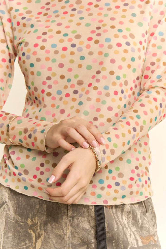 nude colored mesh top with a colorful polka dot pattern