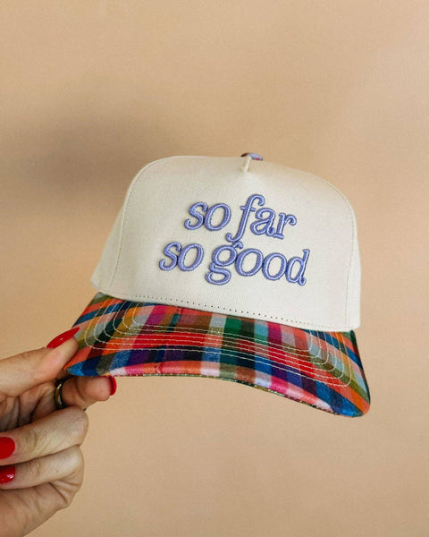 embroidered trucker hat with the message "so far so good"