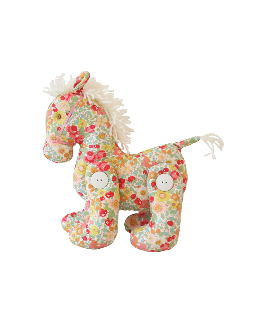 jointed pony doll in a spring blossom floral pattern 