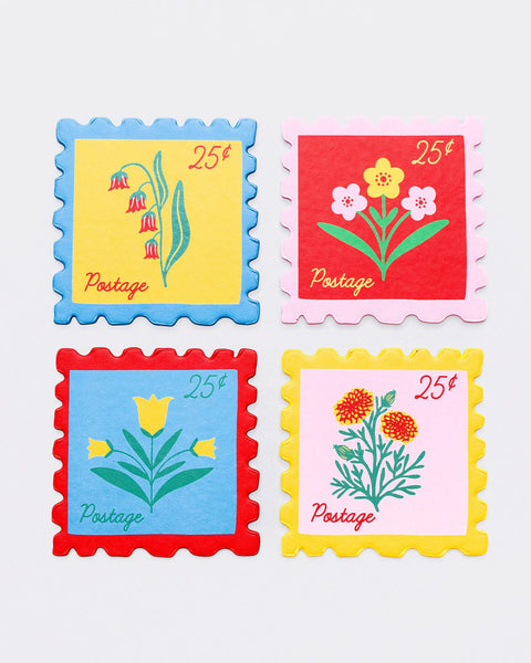 set of four leatherette coasters in the shape of colorful postage stamps