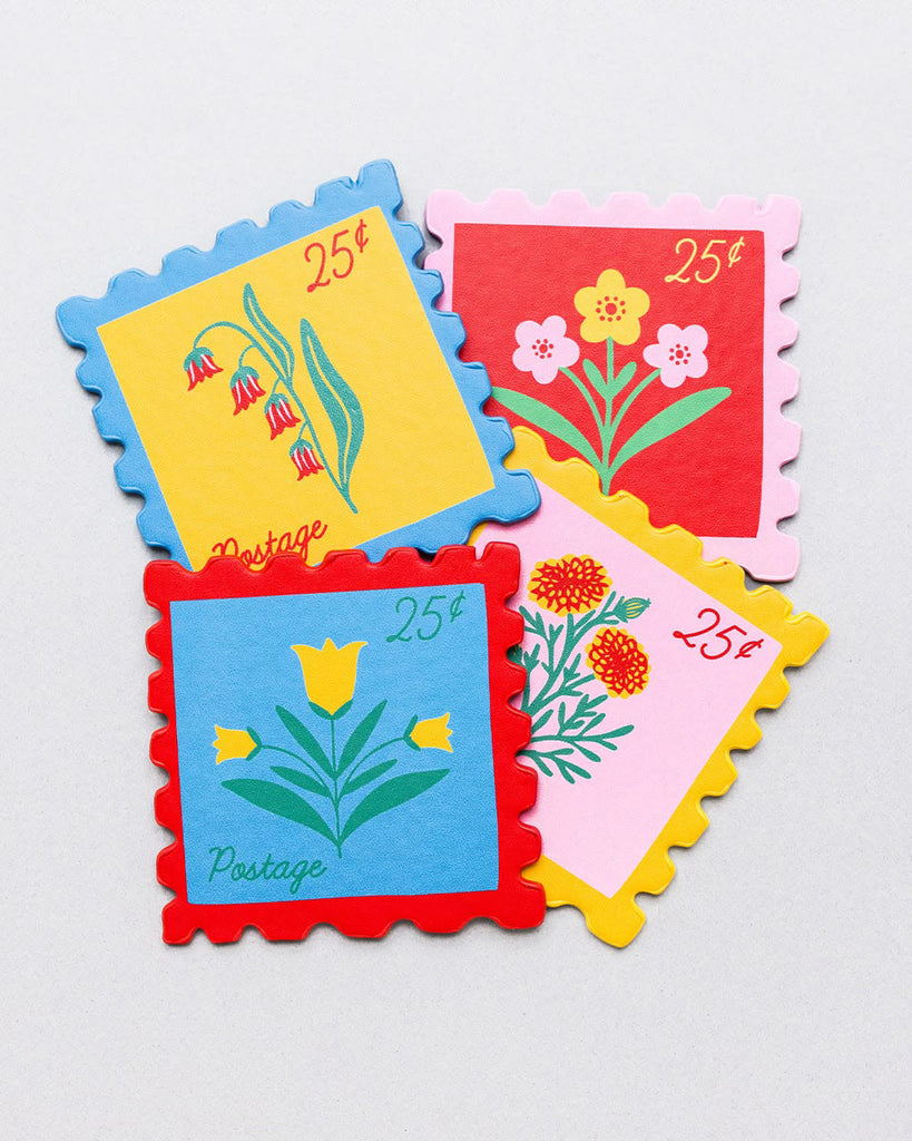 set of four leatherette coasters in the shape of colorful postage stamps