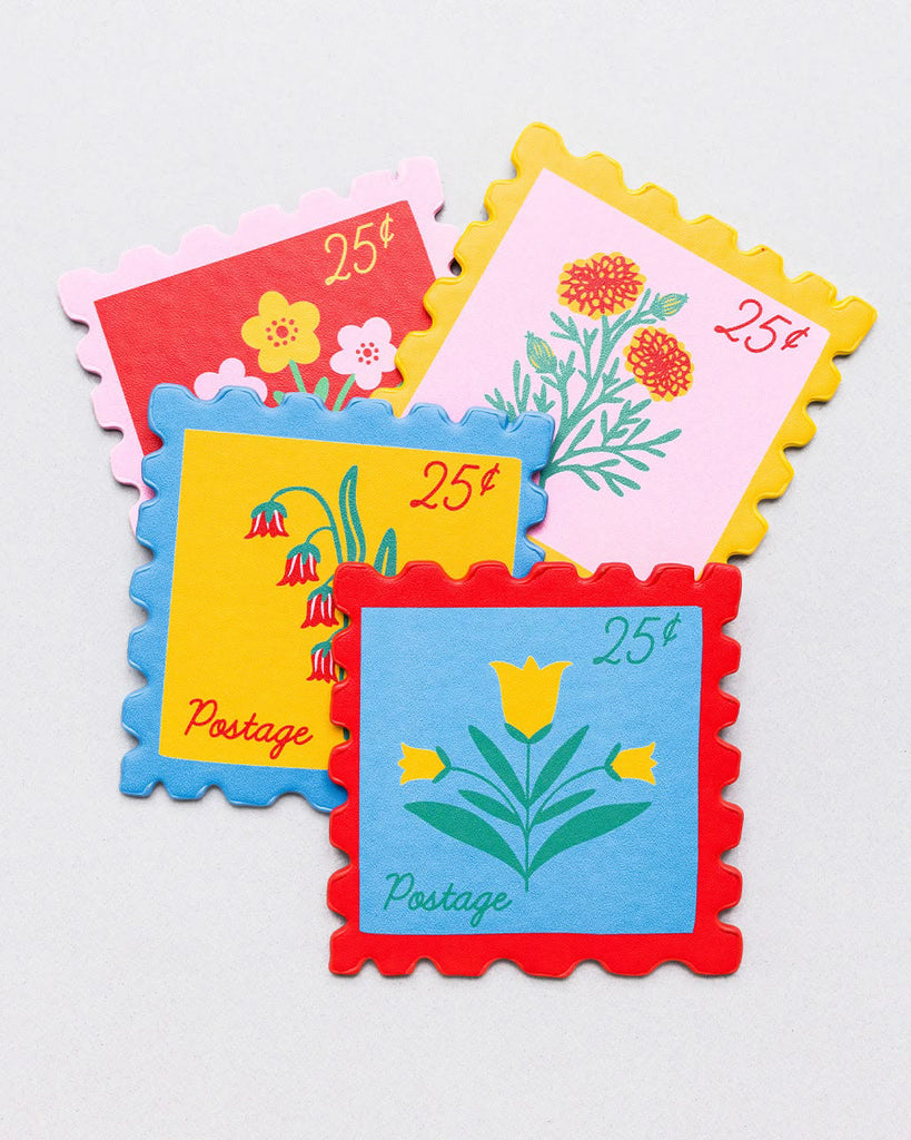 set of four leatherette coasters in the shape of colorful postage stamps