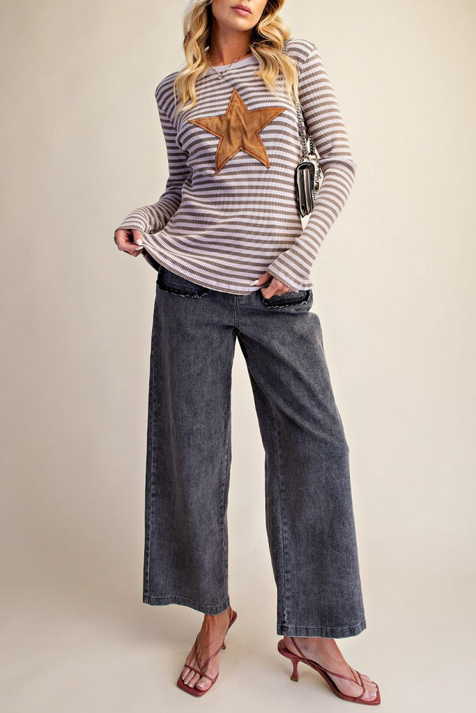 ribbed long sleeve top in muted brown and pale purple stripes with a star patch detail in tan