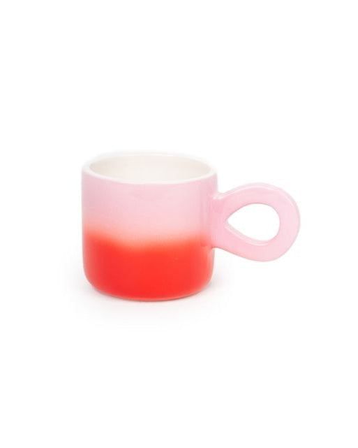 Gradient mug with pink top and red bottom on a white background