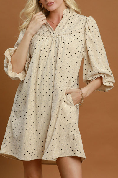 easy to wear midi dress in ecru with petite black polka dots throughout.